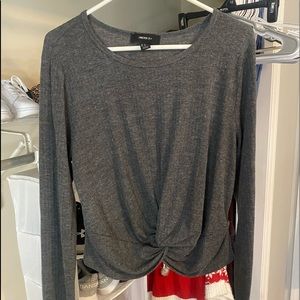 Long-sleeve gray shirt.